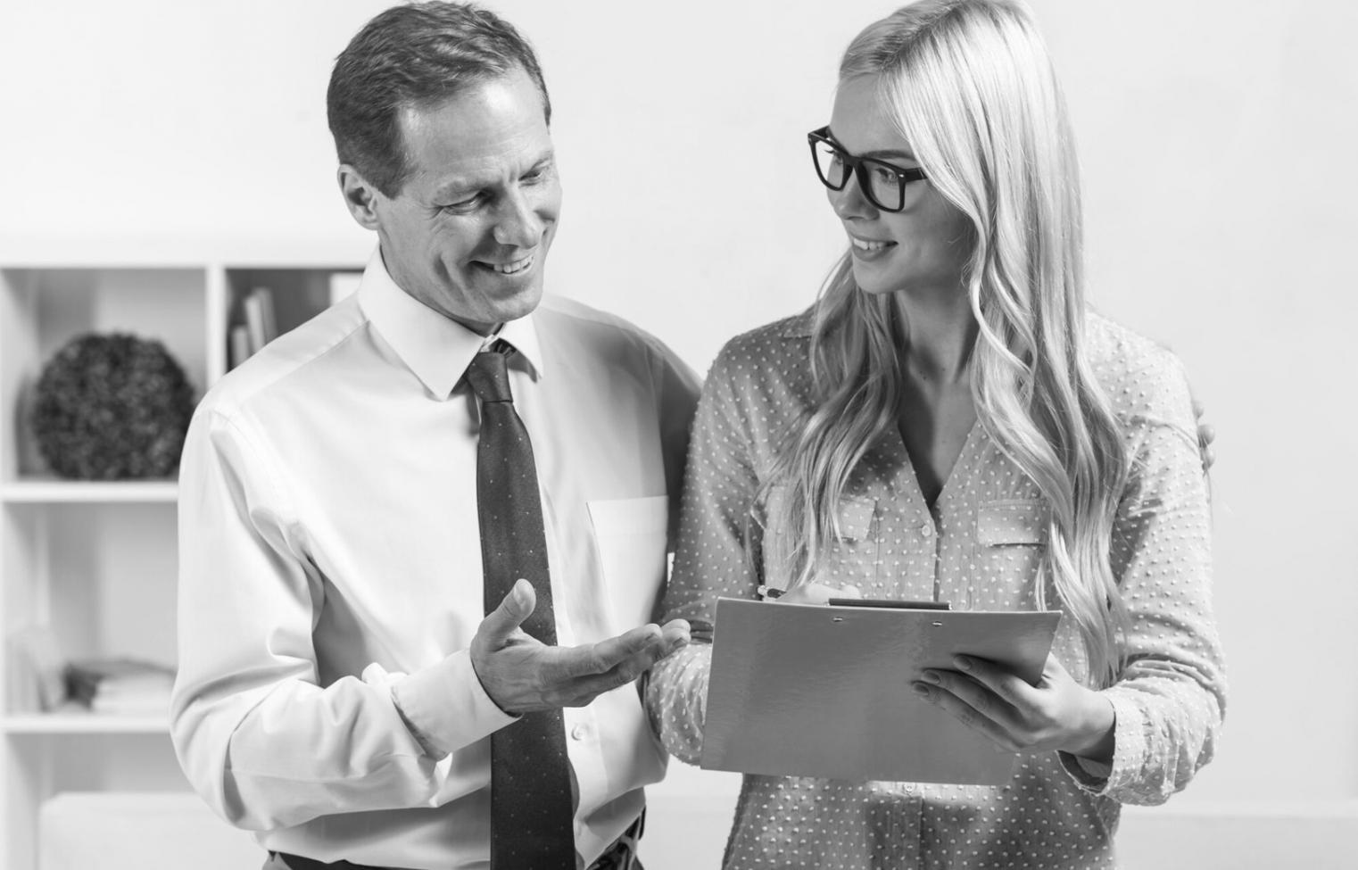 Detailed financial planning session with charts, graphs, and strategic documents spread across a professional workspace